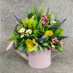 Bright artificial watering can arrangement